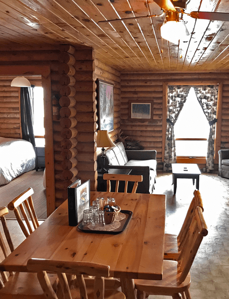 inside-big-log-cabin inside Big Log Cabin living room at Budd's Gunisao Lake Lodge World's Best Trophy Walleye and Northern Pike Fishing