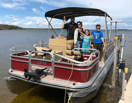 fishing from a pontoon boat at Budd's Gunisao Lake Lodge World's Best Trophy Walleye and Northern Pike Fishing, Manitoba, Canada